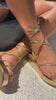 Model wearing gold tone lace up platform sandals video