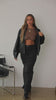 Video of model wearing black denim maxi skirt styled