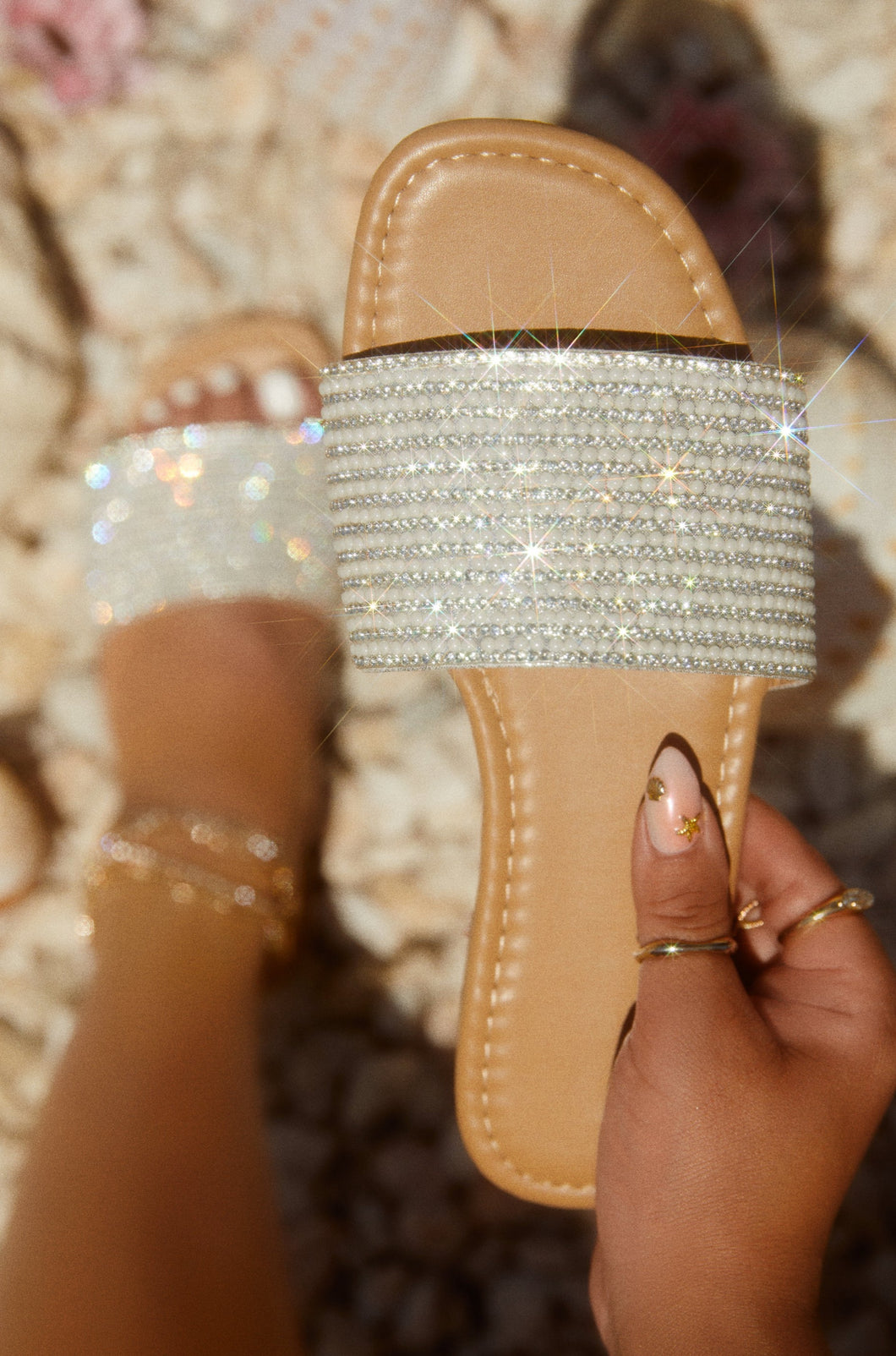 Women Holding Embellished Slip-On Sandals