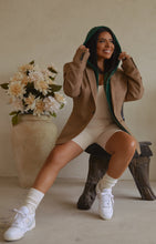 Load image into Gallery viewer, Women Sitting with Ivory Ribbed Knit Jumpsuit
