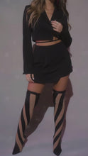Load and play video in Gallery viewer, Model wearing Black Two Piece Set Long Sleeve Crop Blazer with Waist Tie Detail High Waist Mini Skort Asymmetrical Hemline
