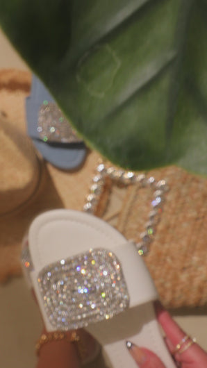 Video of white embellished slip on sandal