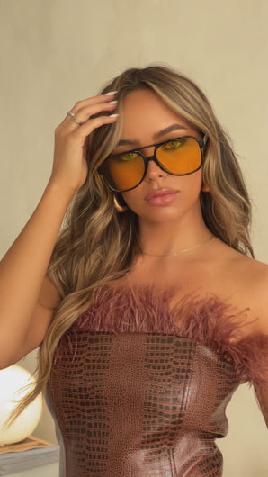 Model Wearing Black Frame with Tan Lens Oversized Sunglasses