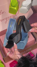 Load and play video in Gallery viewer, woman holding black satin chunky heel
