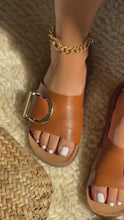 Load and play video in Gallery viewer, Model wearing tan flat slip on sandals video
