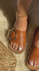 Model wearing tan flat slip on sandals video