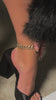 Model wearing black heel mules