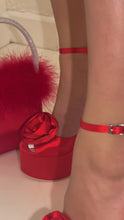 Load and play video in Gallery viewer, Red platform chunky heel with 3D flower detailing on model
