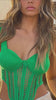 Model wearing rib knit and crochet green top