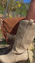Load and play video in Gallery viewer, Brown suede bag with fringe detailing paired with ivory cowgirl boots
