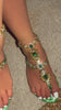 Green leaf embellished sandals on model