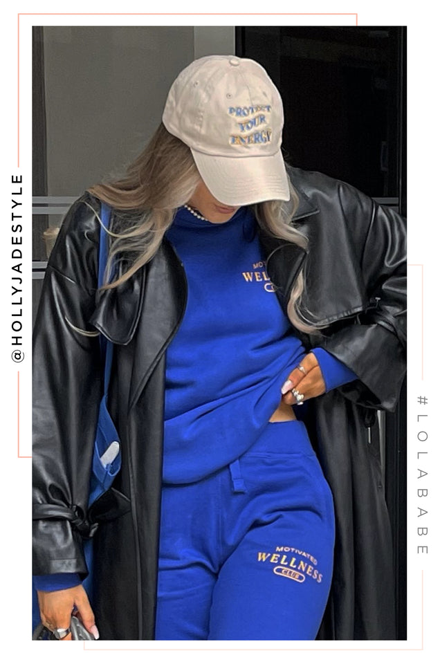 Load image into Gallery viewer, woman wearing royal blue fleece jogger and crewneck two piece exclusive merch by miss lola
