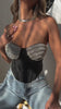 Model wearing black rhinestone embellished corset top