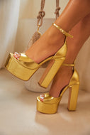 Women Wearing Gold Platform Heels