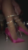 pink pumps with rhinestone coil detail going around heel and ankle