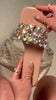 Nude sandals with stone charms on strap