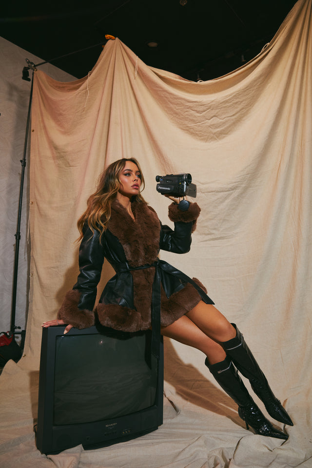 Load image into Gallery viewer, Model Sitting on TV Wearing Jacket as a Dress
