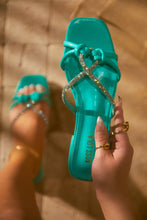 Load image into Gallery viewer, Women Holding Teal Slide Sandals
