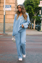 Load image into Gallery viewer, Women Standing with Blue Pants
