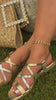 Model wearing gold tone strappy sandals video