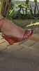 Close up of wedge heel with lace up straps snake orange color