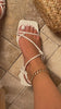 Model wearing white block strappy mid heel