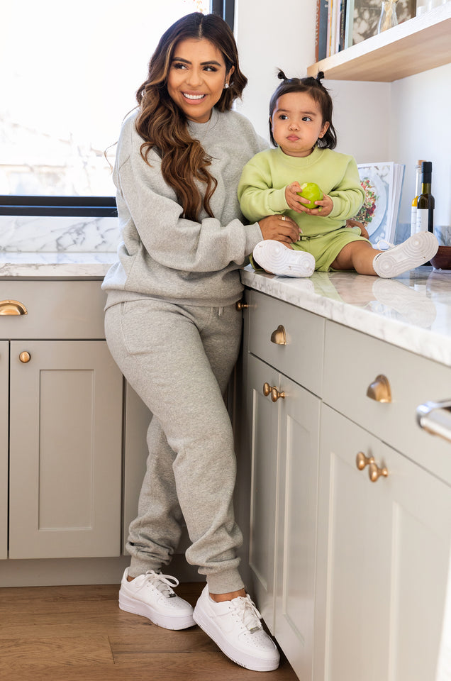 Load image into Gallery viewer, model wearing grey sweatsuit
