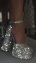 Load and play video in Gallery viewer, Model wearing silver embellished platform block heels
