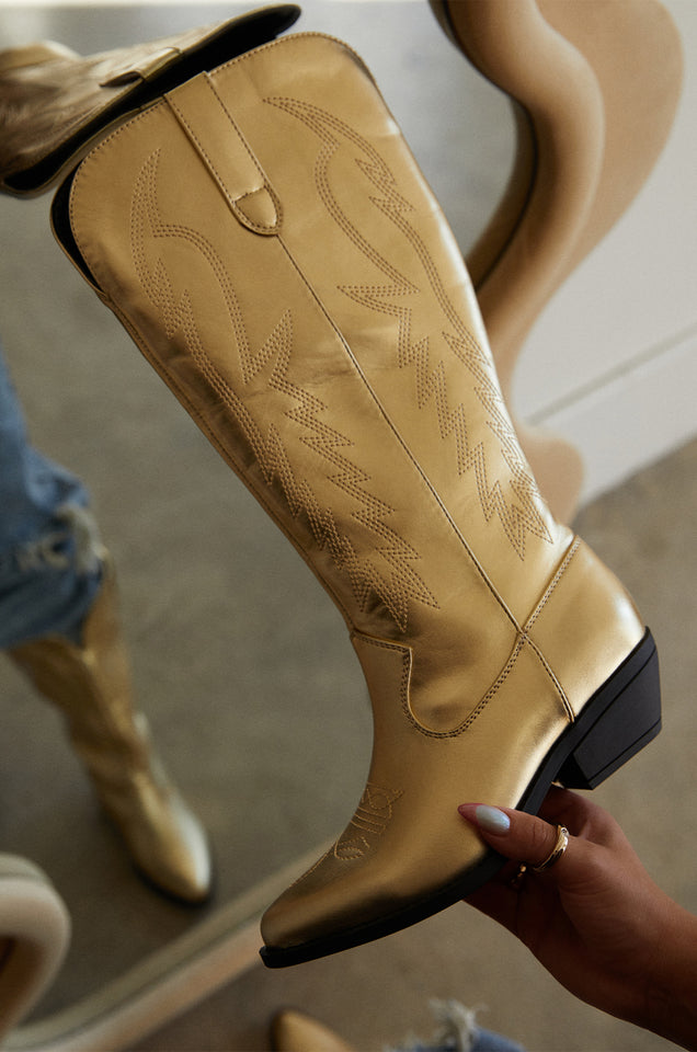 Load image into Gallery viewer, Model demonstrating Gold Boots With Stitched Detail 
