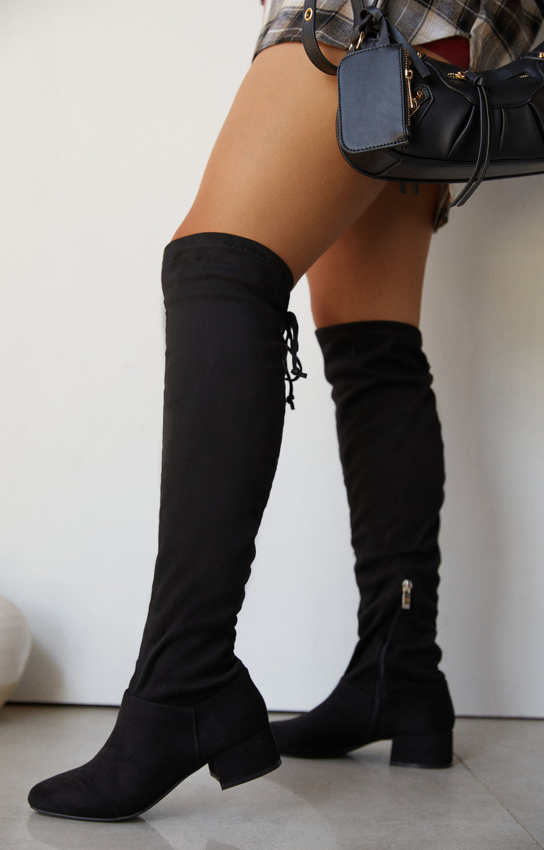Model Wearing Black Knee High Boots