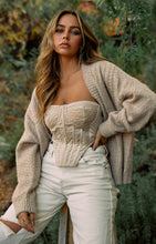 Load image into Gallery viewer, Model Sitting Wearing Nude Velvet Corset Top
