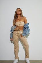 Load image into Gallery viewer, Model Wearing Nude outfit Styled with Blue Denim Jacket
